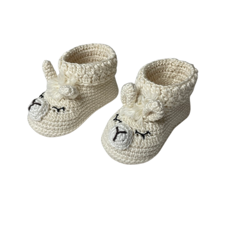 Dbaby Cuzco These Ivory llama Shoes are perfect for your little one's delicate feet.