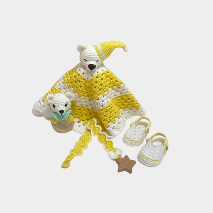 Neutral handmade crochet yellow teddy bear security blanket set with matching shoes, rattle, and pacifier holder.