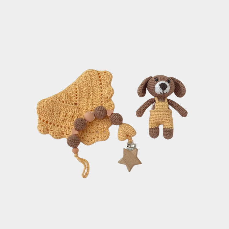 Little puppy set includes 100% hypoallergenic organic cotton crochet toy, with matching pacifier holder, and handmade crochet bid.