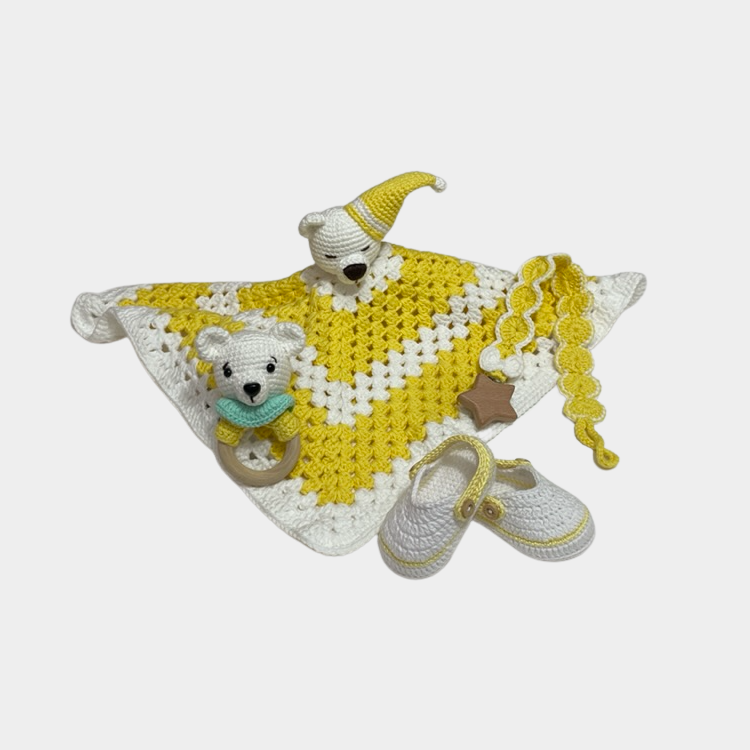 Neutral handmade crochet yellow teddy bear security blanket set with matching shoes, rattle, and pacifier holder.
