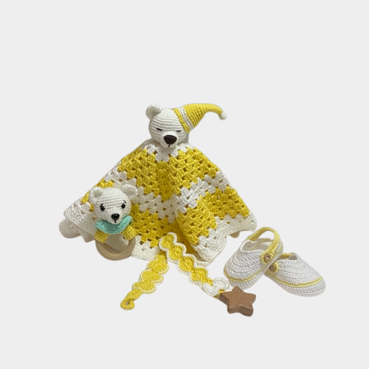 Neutral handmade crochet yellow teddy bear security blanket set with matching shoes, rattle, and pacifier holder.