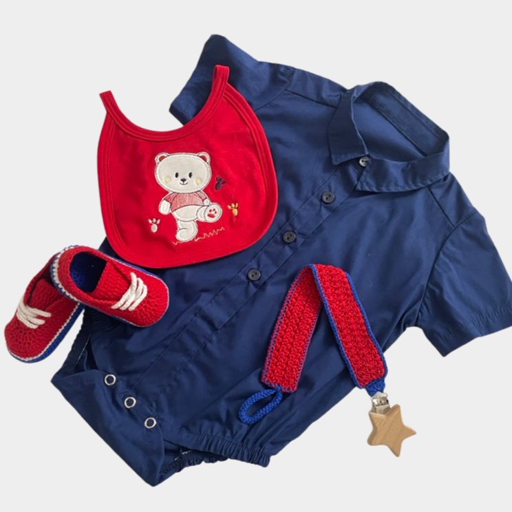 Pima cotton navy blue handmade button-down onesie, with red and blue matching hypoallergenic organic cotton crochet shoes, bid and pacifier holder.