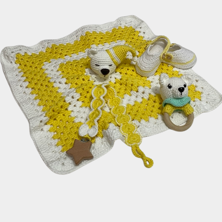 Neutral handmade crochet yellow teddy bear security blanket set with matching shoes, rattle, and pacifier holder.