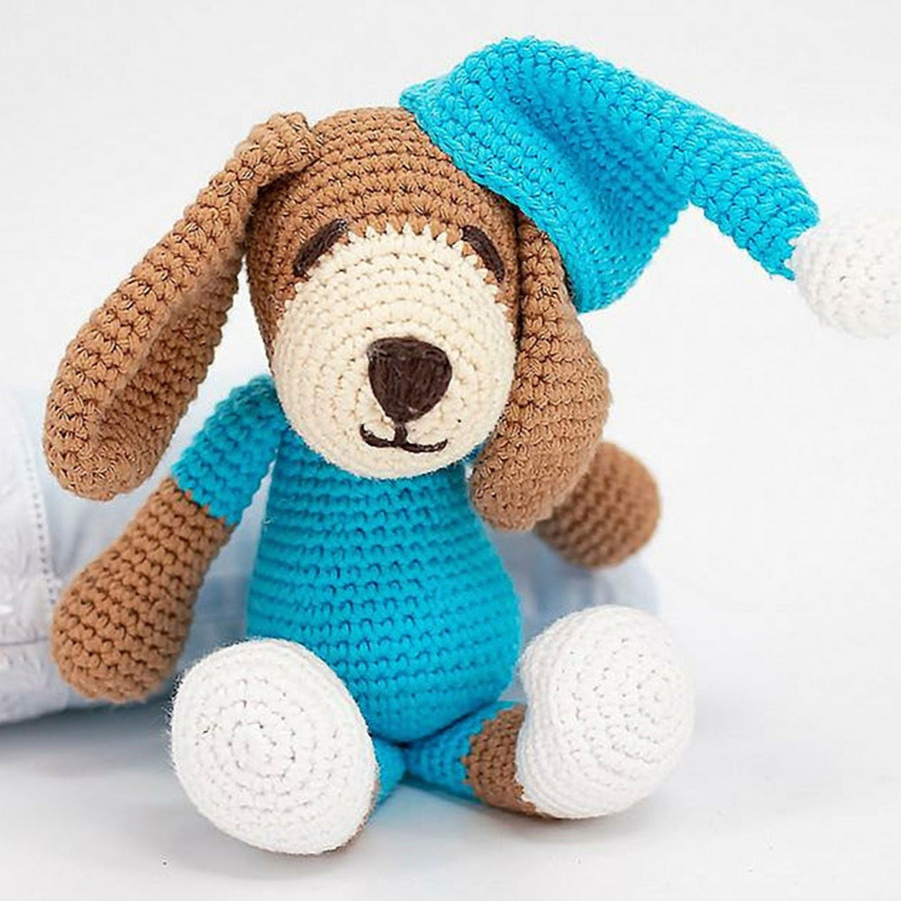 Crafted with precision using 100% organic hypoallergenic cotton, the Blue Doggie Crochet Toy is an ideal baby gift.