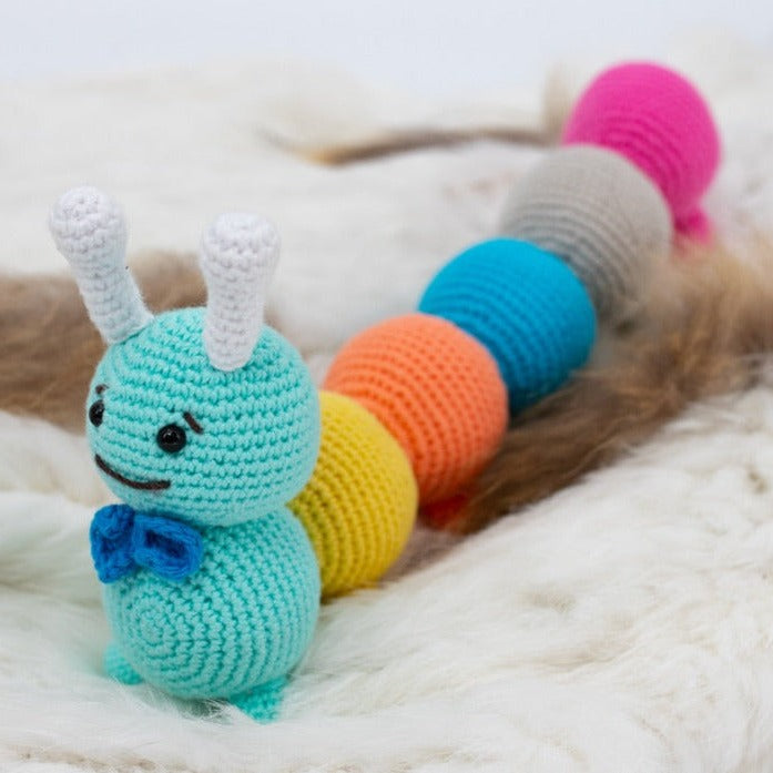 Multicolor 100% hypoallergenic organic cotton crochet caterpillar plush toy.